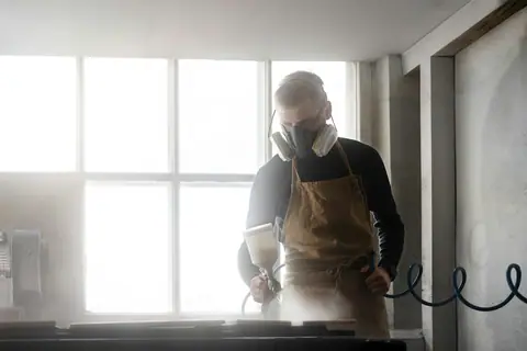 Technician prepping with a respirator