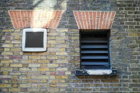 Brick wall with vent openings