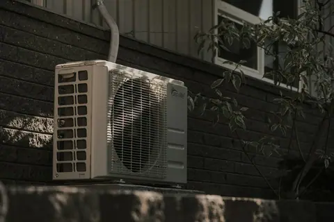 Outdoor condenser beside a wall