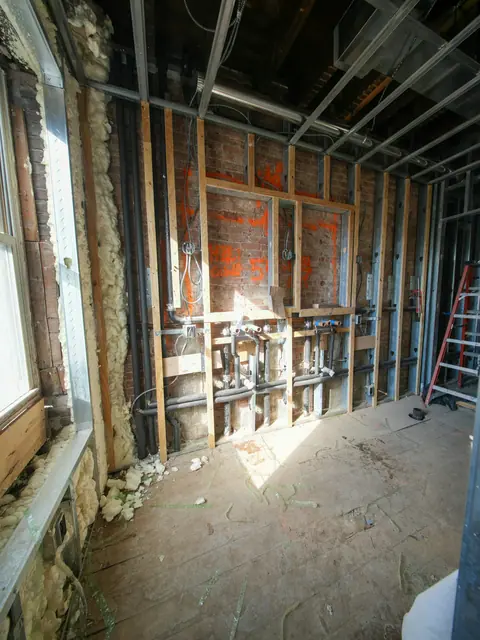 Gutted room with exposed wall cavity